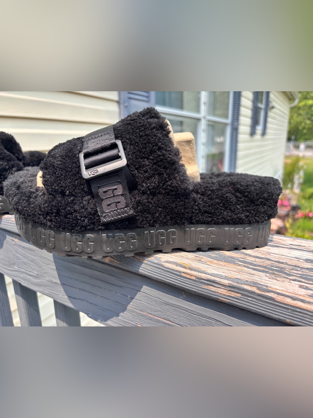 UGG size 8 Worn Once $45.00 Black with Real Fur from lamb